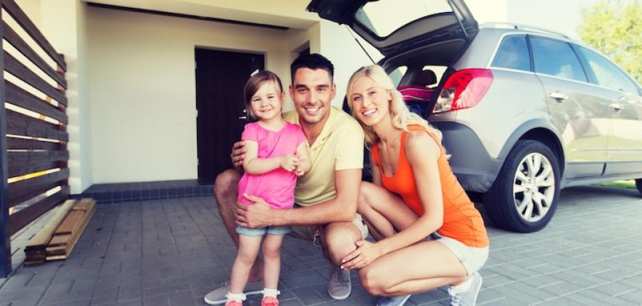 transport-leisure-road-trip-people-concept-happy-family-with-little-girl-hatchback-car-home-parking-space_380164-151317